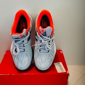 Never worn New Balance all court tennis shoes. 8.5 b. Orange/Grey